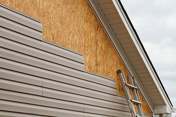 Professional Emergency Siding Repair technician working in Guilford, IN